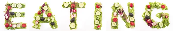 Word eating made of salad — Stock Photo, Image