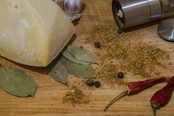 Cheese and spices kitchen composition, photographed in the studio.