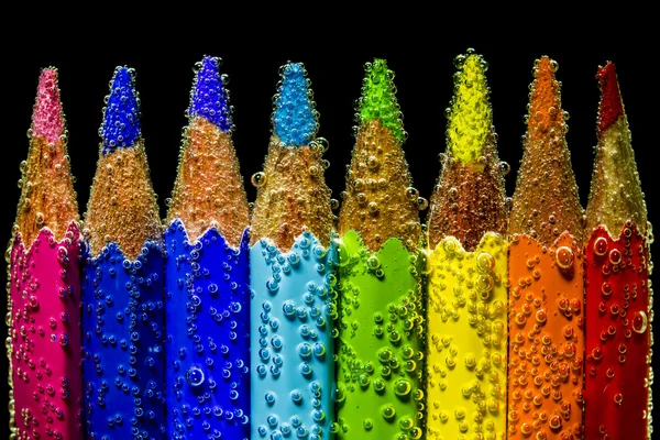 Цветные карандаши, делающие радугу Стоковая Картинка