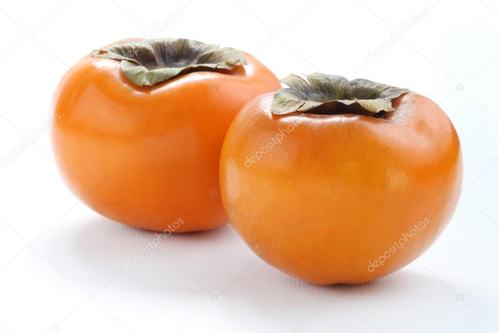 Persimmons on white background, macro