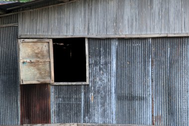 Wooden window on zinc wall of house in countryside, Chiang Mai, 