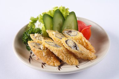 Deep fried Shishamo on ceramic dish isolated on white background