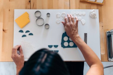 Creating Jewelry in Wooden Table