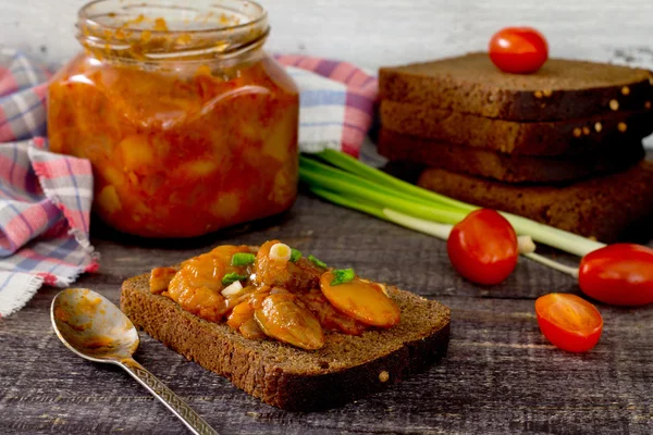 Home caviar tomato and beans on the wooden table dark — Stock Image Home caviar tomato and beans on the wooden table dark Stock Photo