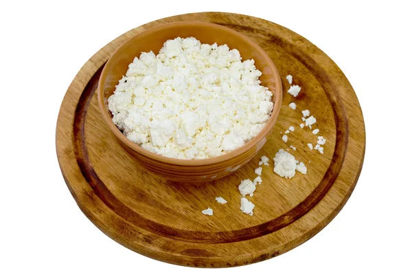 Homemade cottage cheese in a bowl on a wooden board — Stock Photo, Image