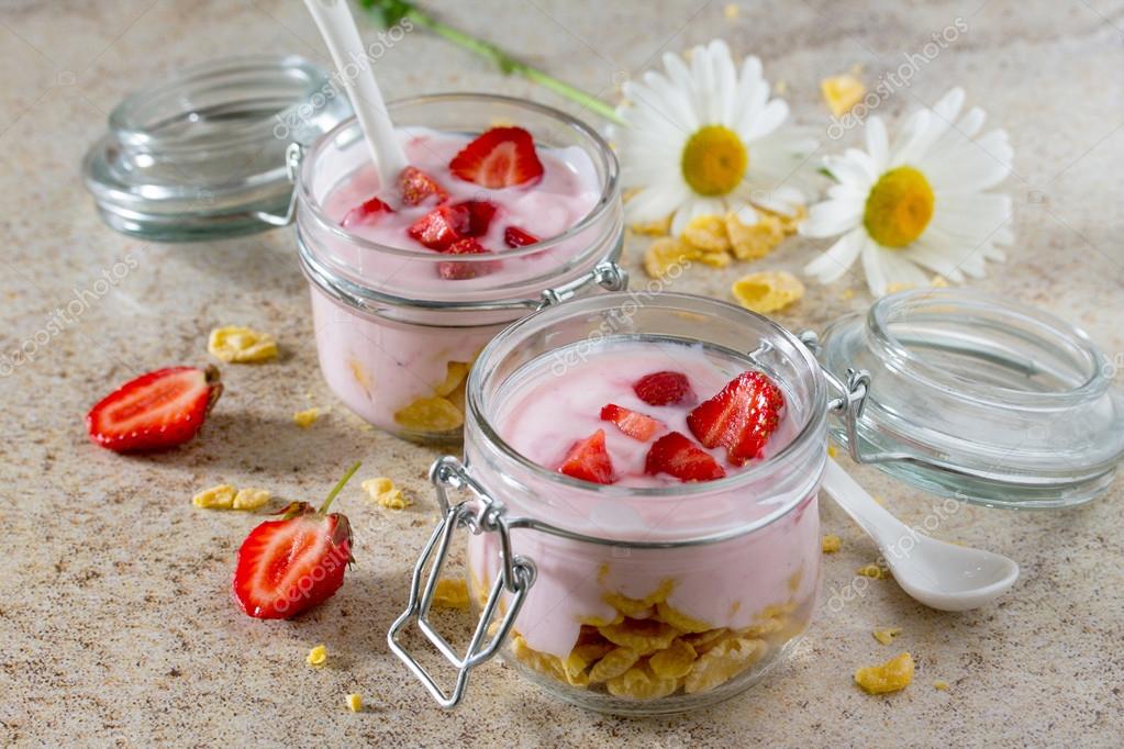 Homemade yogurt with corn flakes and berries, healthy eating yog