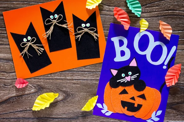 Dítě vytvoří přání k narozeninám pro Halloweenský papír černá kočka i. — Stock fotografie