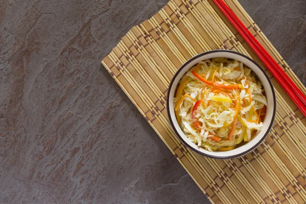 Korean salad of cabbage, carrots, sweet peppers - kimchi in an A — Stock Photo, Image