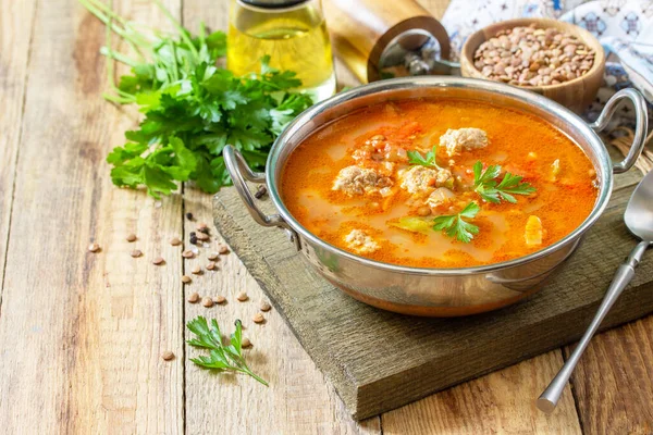 Tomato lentil soup with meatballs and vegetables on a wooden table. Copy space. — Stock Image Tomato Lentil Soup Meatballs Vegetables Wooden Table Copy Space Royalty Free Stock Images
