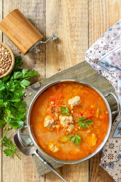 Tomato lentil soup with meatballs and vegetables on a wooden table. Top view flat lay background. Copy space. — Stock Image Tomato Lentil Soup Meatballs Vegetables Wooden Table Top View Flat Stock Image