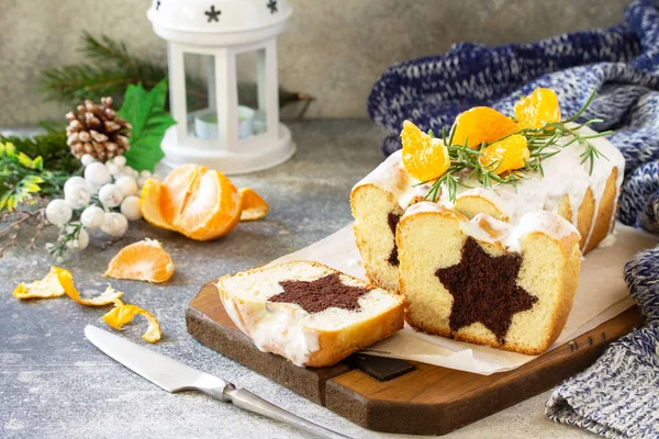 Winter dessert. chocolate star cupcake with sour cream frosting on the festive table.