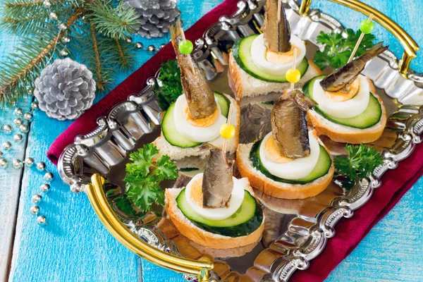 Canape with fresh cucumber sprats and New Year's Eve — Stock Photo, Image
