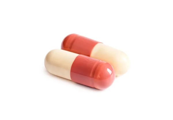 Cápsula de medicamento sobre fundo branco — Fotografia de Stock