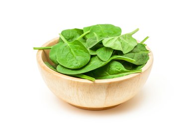 Beyaz arka plan üzerinde izole ahşap kase ıspanak yaprağı