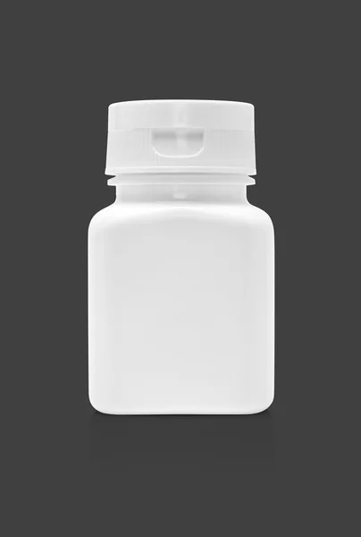 Botella de plástico de la medicina del embalaje en blanco aislado sobre fondo gris — Foto de Stock