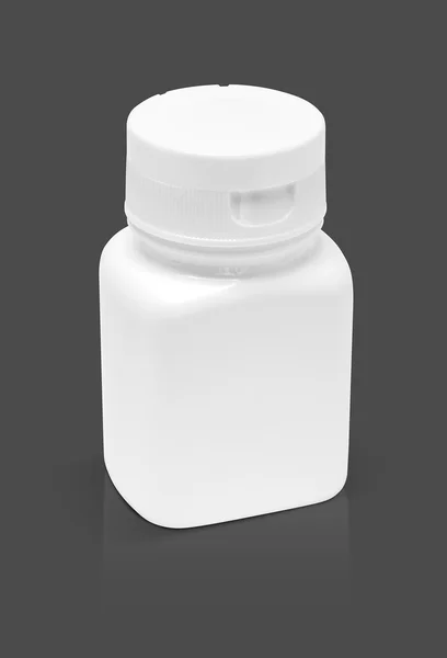 灰色的背景上孤立的空白包装药用塑料瓶 — 图库照片