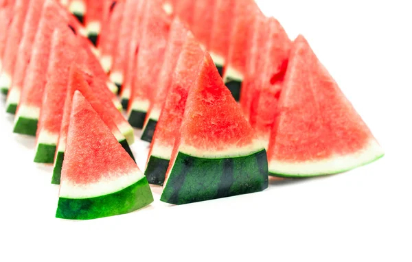 Rote Wassermelone in Scheiben geschnitten auf weißem Hintergrund — Stockfoto