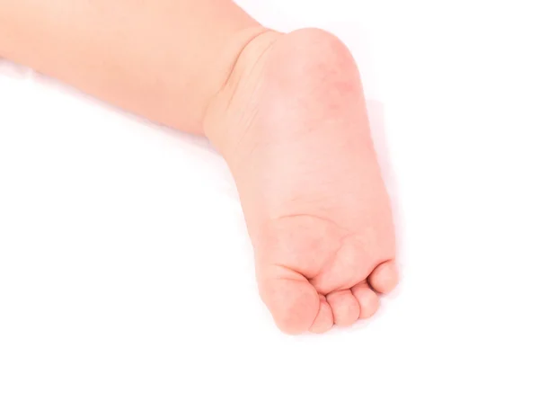 Piede del bambino 9-12 mese isolato in fondo bianco — Foto Stock