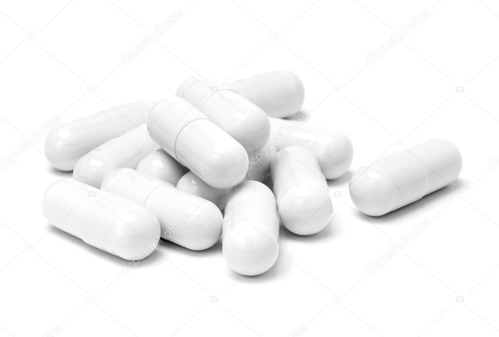 White medicine capsules isolated on white background