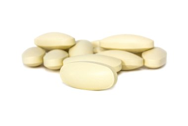 Ek tabletler üzerinde beyaz backgrounnd izole