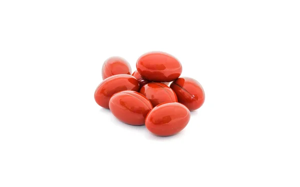 Κάψουλες κόκκινο βιταμίνη που απομονώνονται σε λευκό φόντο — Φωτογραφία Αρχείου