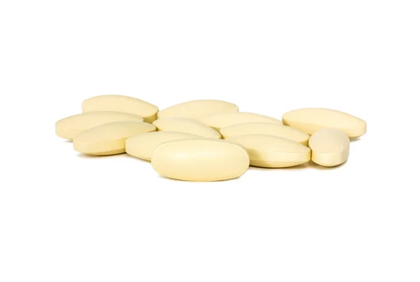 Tabletek suplementów diety na białym tle na biały backgrounnd — Zdjęcie stockowe