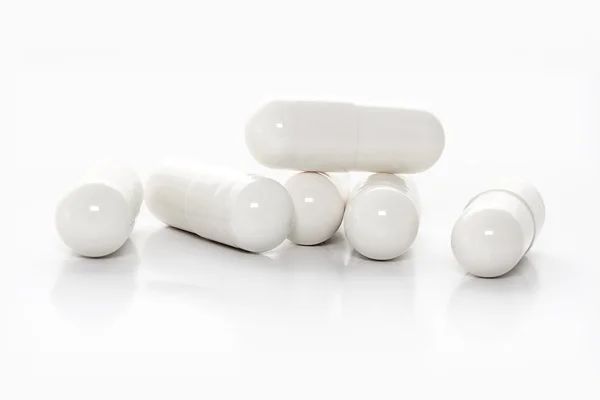 Kapsułki białe medycyny — Zdjęcie stockowe