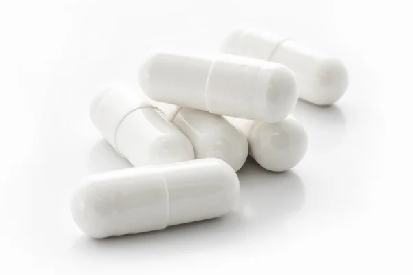 Kapsułki białe medycyny — Zdjęcie stockowe
