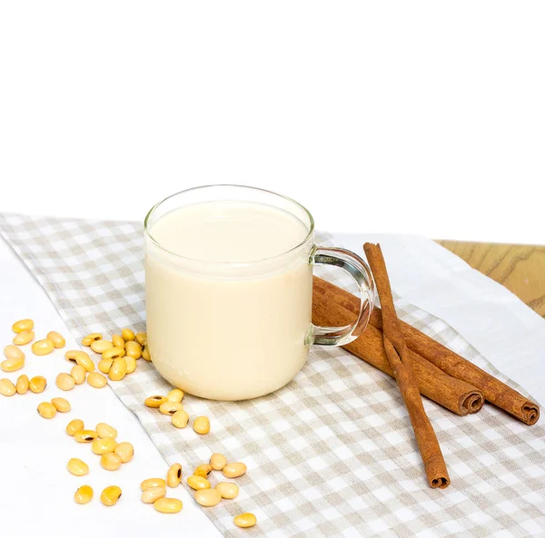 Soy milk with soy bean isolated on white background
