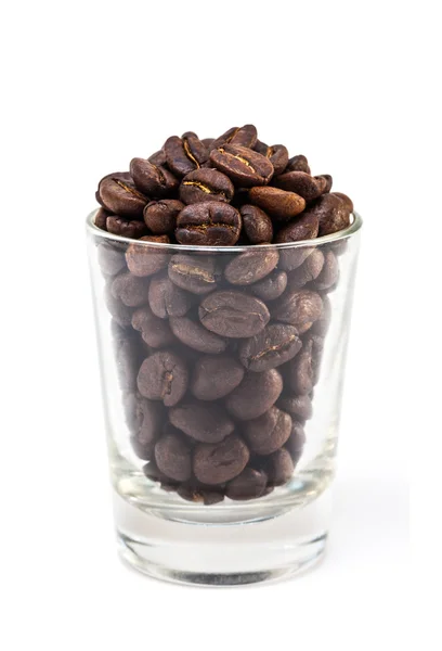 Coffee beans in glass shot isolated on white background — Stock Photo, Image