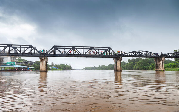 Railway Bridge of world war history in the rain, River Kwai, Kanchanaburi, Thailand