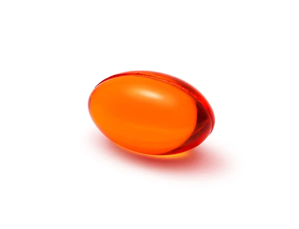 Red transparent supplement capsule isolated on white background — Stock Photo, Image