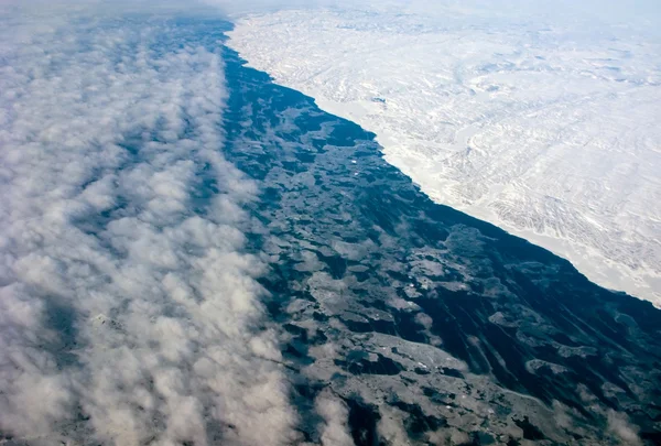 Aerial view of the Greenland coastline with ocean and clouds — Stock Photo, Image