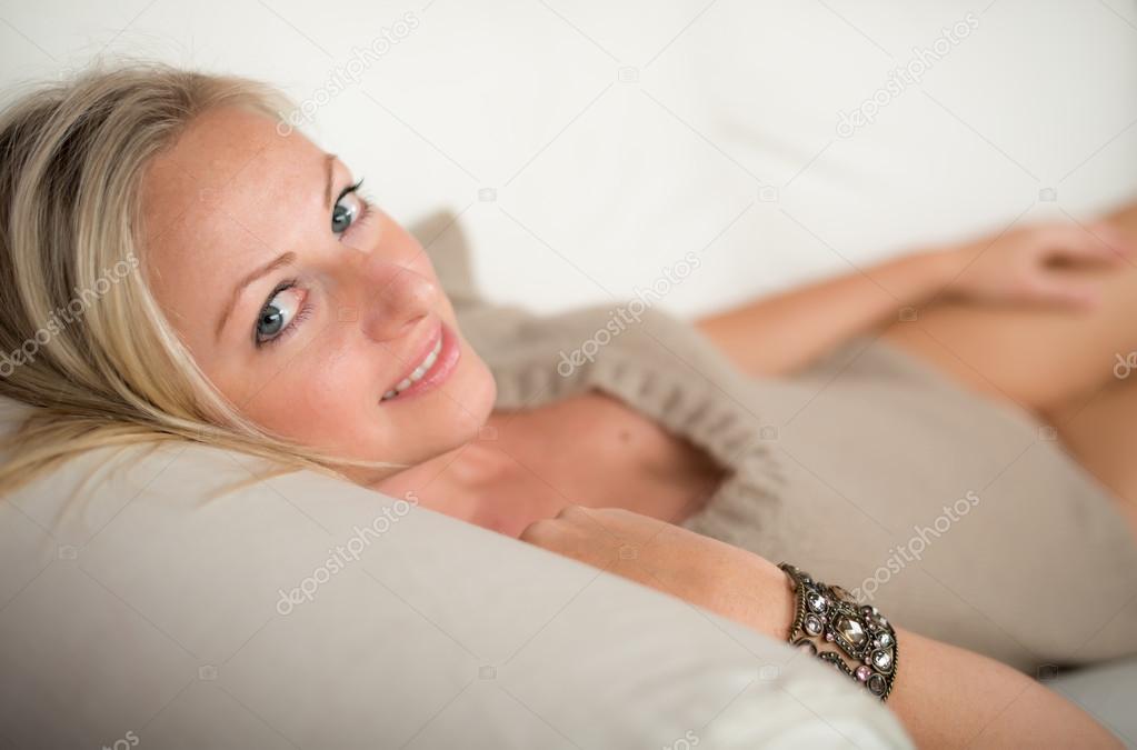 Appealing young woman on a sofa