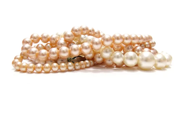Pastel colored bead and pearls on a white background — Stock Photo, Image