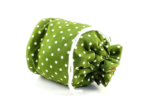 Green polka dots fabrice bag on white background — Stock Photo, Image