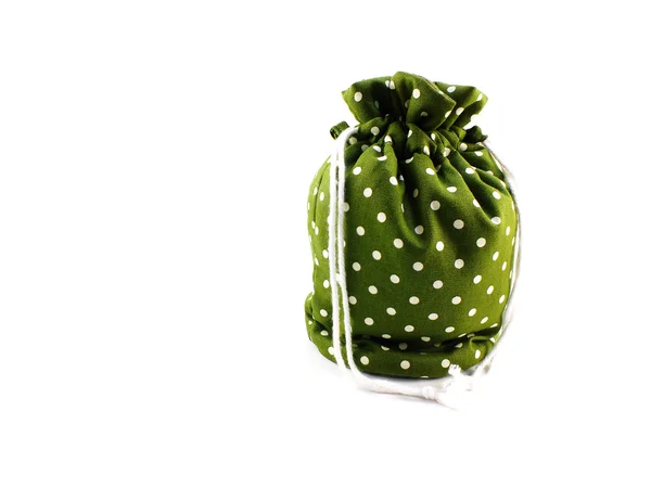Green polka dots fabrice bag on white background — Stock Photo, Image