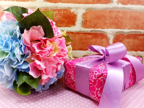 gift box present and flowers decoration background