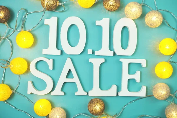 10.10 Sale alphabet letter with LED cotton balls on blue background