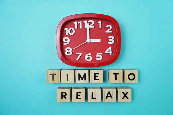 Time To Relax alphabet letter with alarm clock on blue background