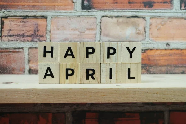 Happy April Αλφάβητο Γράμμα Στα Ράφια Ξύλινο Φόντο — Φωτογραφία Αρχείου