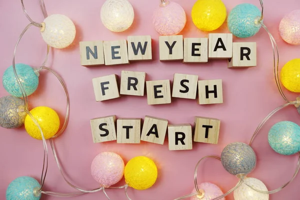 New Year Fresh Start alphabet letter on pink background