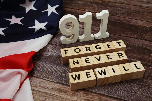 911 We will Never Forget Word alphabet letters on wooden background