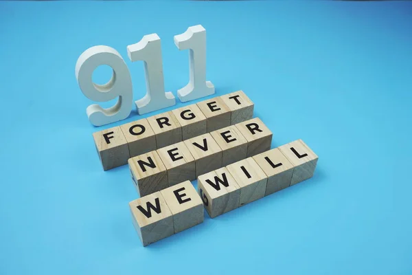 911 We will Never Forget Word alphabet letters on blue background