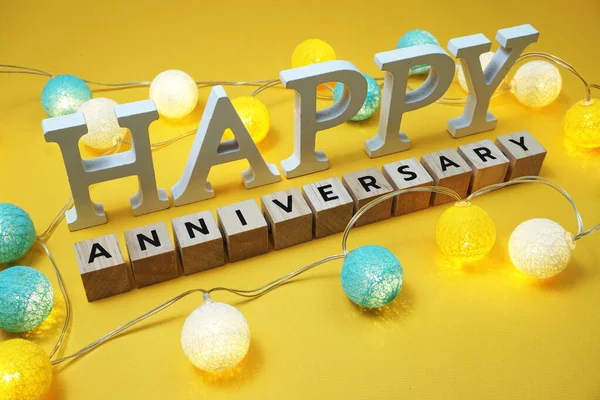 Happy Anniversary Alphabet Letter Led Cotton Balls Yellow Background — Stock Photo, Image