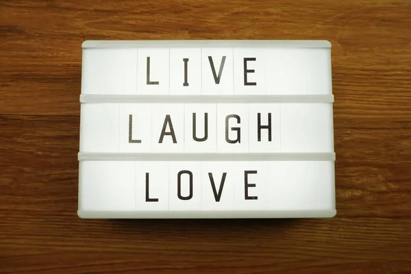 Live Laugh Love Woord Lichtbak Houten Achtergrond — Stockfoto