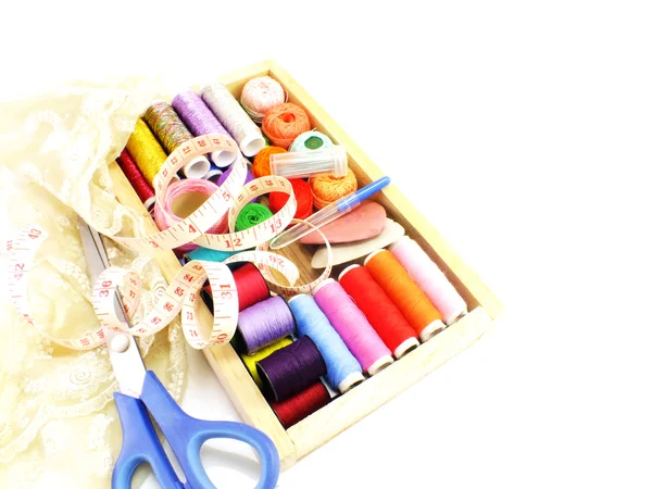 Sewing kit background with color threads meter and scissors — Stock Photo, Image