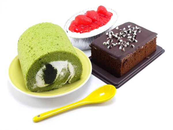 Strawberry cheesecake green tea roll cake and chocolate cake — Stock Photo, Image