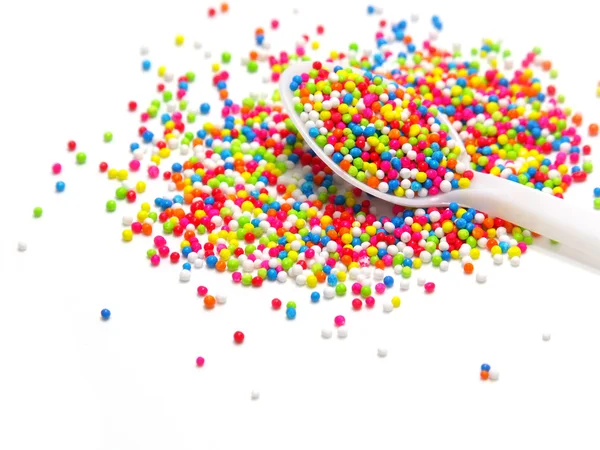 Colorful sugar pearls in white spoon — Stock Photo, Image