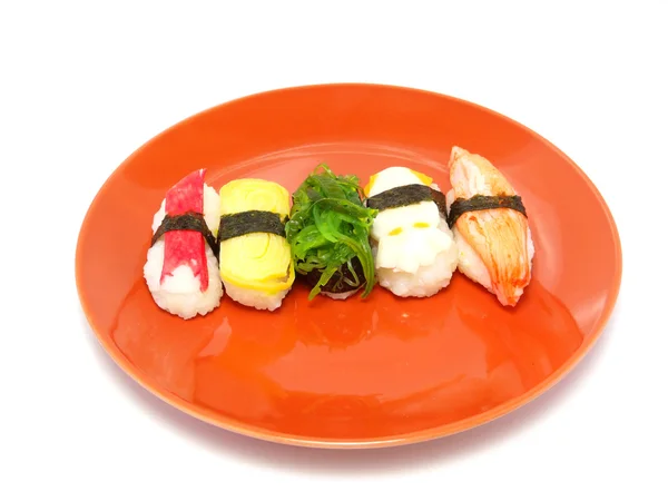 Delicioso sushi en plato de naranja — Foto de Stock